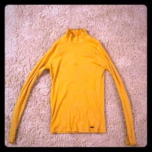 A yellow turtle neck